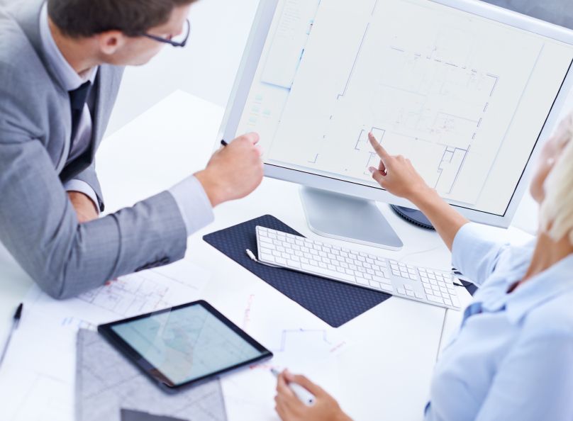 Two Architects Making Sure the Blueprints are according to plan