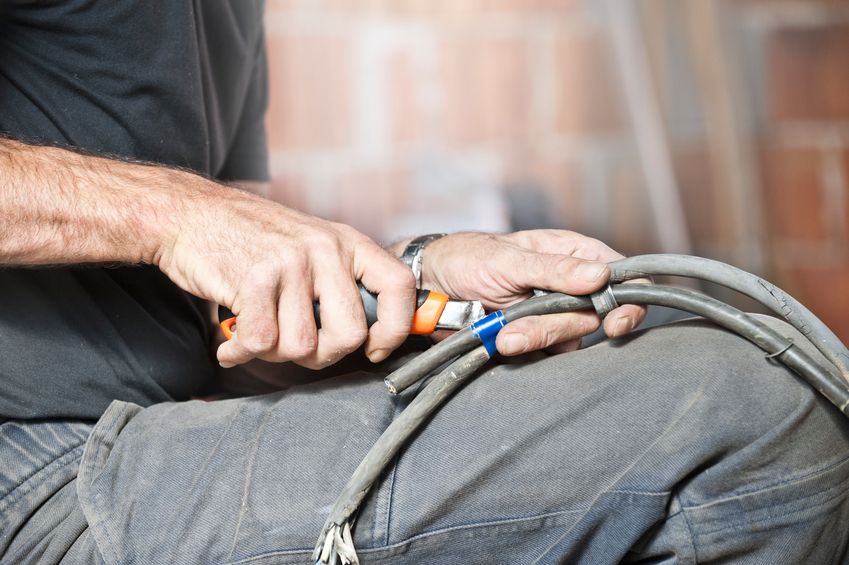 electrician working on wires in home